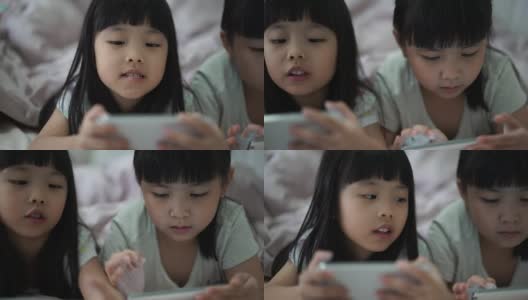 姐妹们在智能手机上玩电子游戏高清在线视频素材下载
