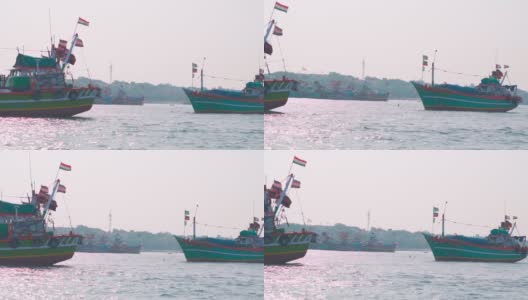 印度古吉拉特邦奥卡港阿拉伯海的船只。港口的渔船上挂着印度国旗。阿拉伯海的小木船。高清在线视频素材下载