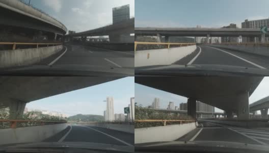 在城市高架桥下的高速公路上，从汽车上向外望去高清在线视频素材下载