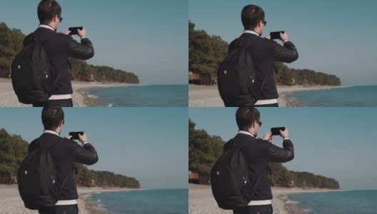 人以海为背景拍了一系列照片，他可以当游客高清在线视频素材下载