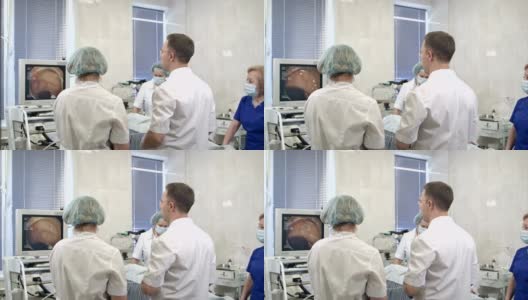 在手术中使用内窥镜设备的医生团队高清在线视频素材下载