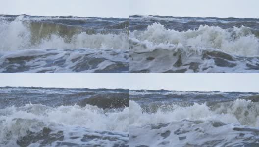 恶劣天气下的暴风雨海浪气旋飓风风慢镜头大海海水，大浪海浪溅海滩。高清在线视频素材下载