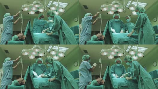 外科医生在手术室为一名男性病人进行手术时合作的团队。高清在线视频素材下载