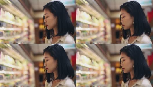 在超市购物的亚洲妇女高清在线视频素材下载
