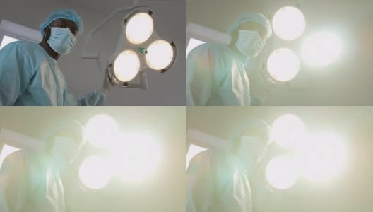 外科医生在摄像机中指挥手术灯光高清在线视频素材下载