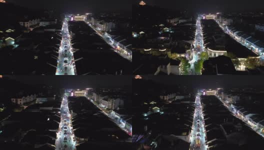 夜景照亮了杭州市内著名的行人拥挤的街道区域，航拍了4k中国全景图高清在线视频素材下载