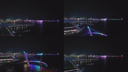青岛夜景时间照亮了中国著名的奥林匹克湾码头航拍全景4k高清在线视频素材下载