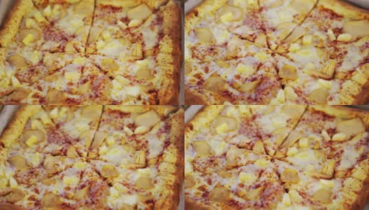 方形披萨配鸡肉和菠萝。为聚会准备的零食。高清在线视频素材下载