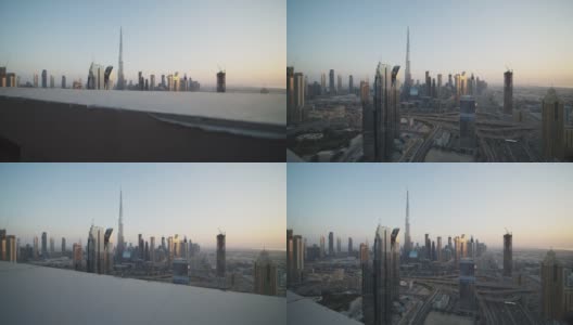 日落时分，迪拜的城市中心和哈利法塔。阿拉伯联合酋长国繁忙的城市交通和高耸的摩天大楼高清在线视频素材下载