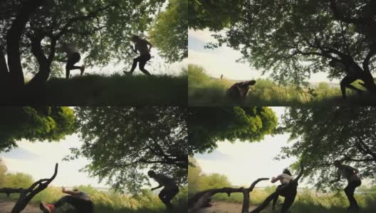 两个女孩在树下奔跑，跑步时摔倒的运动员，侧视，城市背景。晨跑。落在运行高清在线视频素材下载