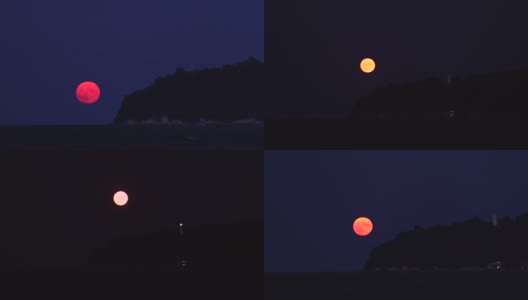 满月在海边的灯塔升起高清在线视频素材下载