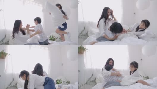 亚洲家庭的妈妈和孩子躺在床上玩得很开心高清在线视频素材下载