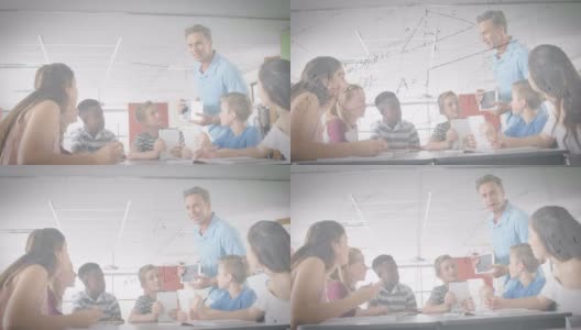 白人男教师用数字平板电脑教学生的数学方程式高清在线视频素材下载
