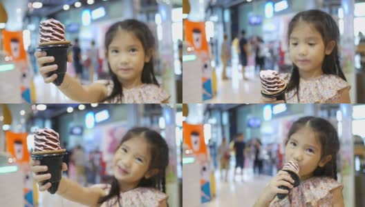 女孩在吃蛋筒冰淇淋高清在线视频素材下载