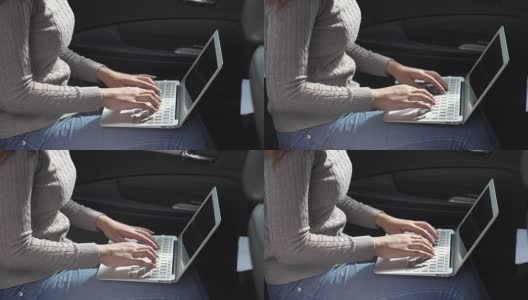 近距离的女人在车上使用笔记本电脑高清在线视频素材下载