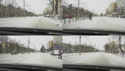 一场大雪过后，汽车载着雪行驶在城市道路上高清在线视频素材下载