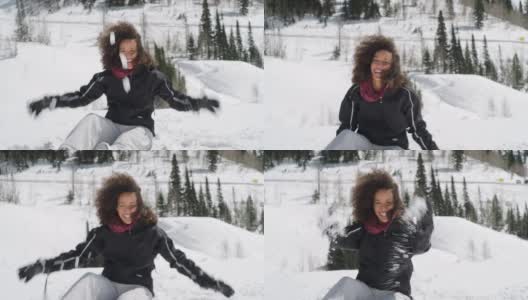 好玩的女人在冬天的山雪高清在线视频素材下载