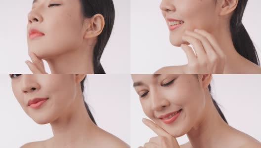 美丽的年轻亚洲女人触摸脸和健康的皮肤的特写。高清在线视频素材下载