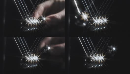 牛顿的球在黑色背景上反射光高清在线视频素材下载