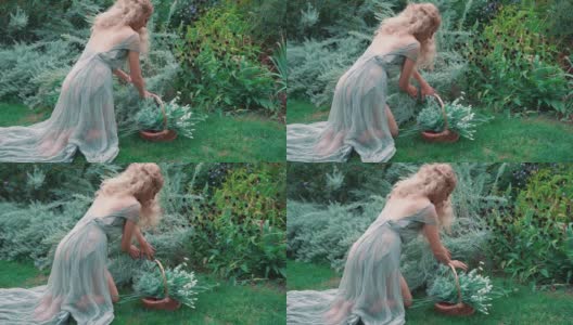 一个年轻的金发女郎跪在地上照料膝上的花园。高清在线视频素材下载
