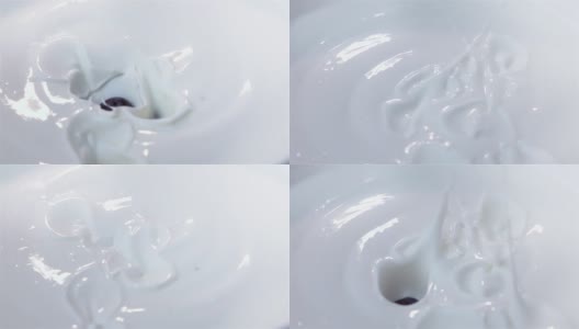 三段蓝莓落入酸奶的慢动作视频高清在线视频素材下载