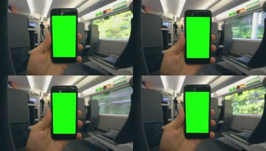 在火车上拿着绿色屏幕的手机高清在线视频素材下载