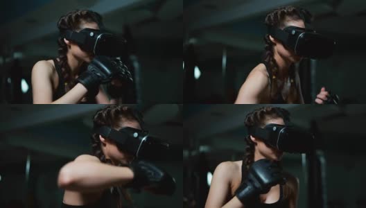 年轻迷人的女子拳击在VR 360耳机训练踢在虚拟现实。Slowmotion拍摄高清在线视频素材下载