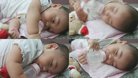 宝宝喝着奶瓶睡觉高清在线视频素材下载