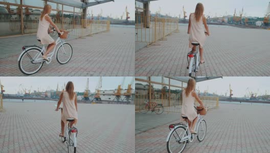 户外时尚肖像优雅的金发女士骑她的嬉皮复古自行车在复古时尚的衣服。享受夏日，在港口摆好姿势。休闲的生活方式。慢动作高清在线视频素材下载