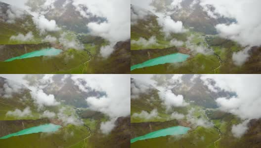 多云的，多雪的秘鲁Humantay湖鸟瞰图。高清在线视频素材下载