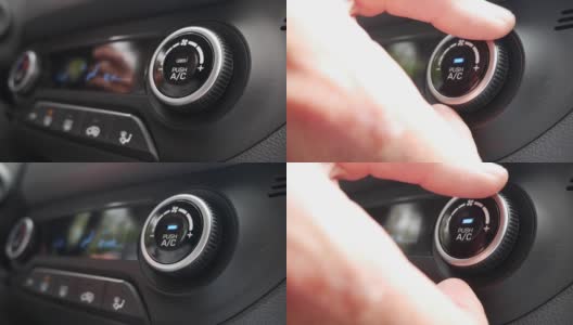 特写，按按钮打开汽车里的空调。男子的手转动按钮，调整车内的舒适度高清在线视频素材下载
