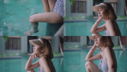 亚洲女人放松在度假的游泳池高清在线视频素材下载