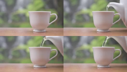 近距离将香茶倒入以自然为背景的白色杯中高清在线视频素材下载