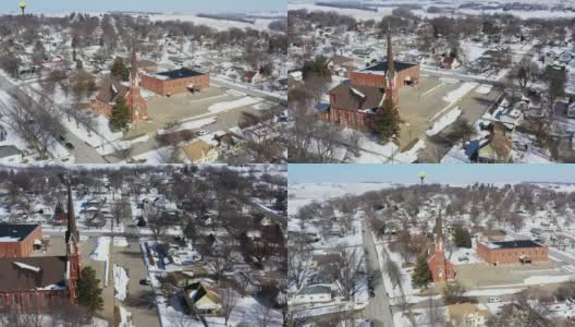 冬天的小镇教堂和水塔，无人机鸟瞰图，Neola，爱荷华州，美国高清在线视频素材下载