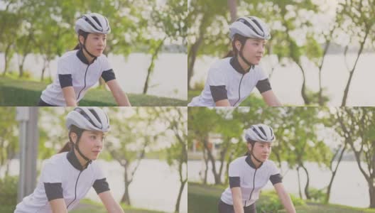 亚洲年轻美丽的女人骑自行车为健康在晚上在公共公园。运动员健康和坚定的女孩在运动服装锻炼通过自行车锻炼运动为她的健康健康。高清在线视频素材下载