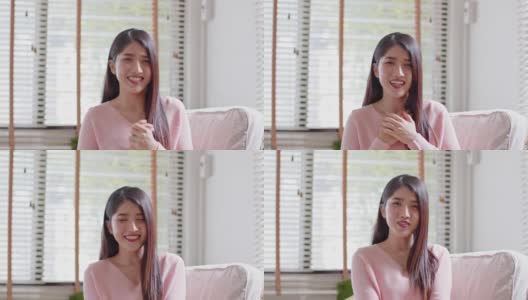 相机第一视图美丽的亚洲年轻女子通过视频会议介绍自己微笑在家里。快乐的肖像老师教练看着相机在线课堂或视频博主记录高清在线视频素材下载