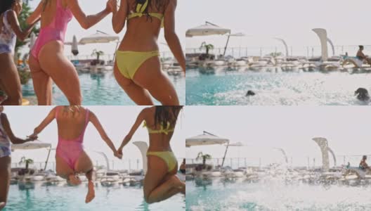 快乐的女朋友们一起在游泳池游泳的背影高清在线视频素材下载