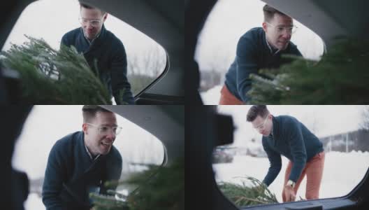 把圣诞树放进汽车后备箱高清在线视频素材下载