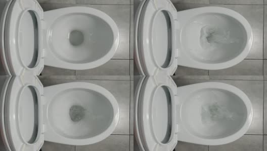 慢镜头:水在一个白色的厕所里流动高清在线视频素材下载
