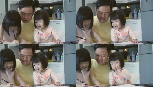 中年亚洲爸爸花时间陪他可爱的小女儿高清在线视频素材下载