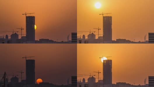 在卡塔尔多哈，一座正在建设中的塔楼，映衬着夕阳的轮廓高清在线视频素材下载