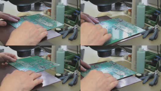 工程师用烙铁修理印刷电路板高清在线视频素材下载