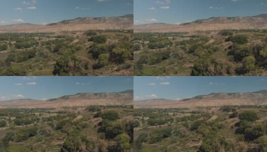 夏季无人机查看科罗拉多河流域农业绿地和水处理和BookCliff山脉4K视频系列高清在线视频素材下载