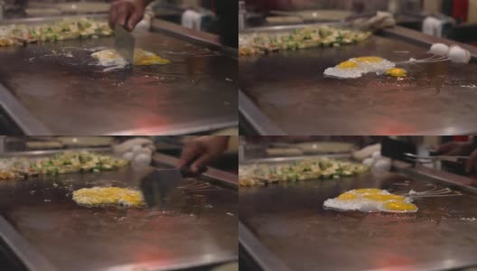 新鲜的鸡蛋在烤炉上打碎并炒制高清在线视频素材下载