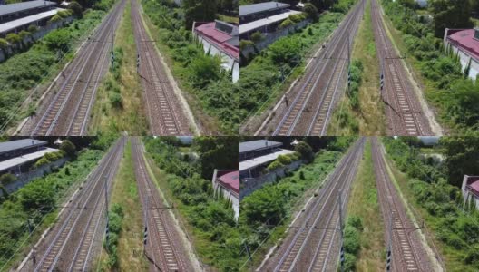 无人机鸟瞰图的火车铁路轨道-在意大利米兰推进铁路的顶部视图-开始旅行高清在线视频素材下载