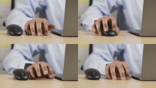 靠近一个白人男子的手，焦急地敲打她的桌子与他的手指，而工作在一个笔记本电脑在办公室。与工作相关的焦虑、压力、无聊、不耐烦和紧张的概念高清在线视频素材下载