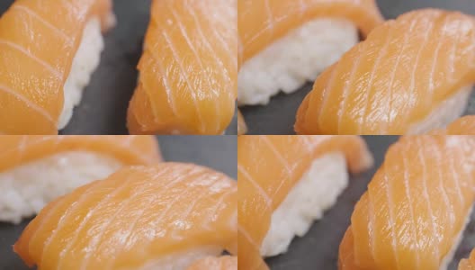 寿司质量高，打开黑色背景，显示其所有的好，饮食和健康的食物，美味的味道，寿司很好与鲑鱼或金枪鱼，是一个典型的日本食物高清在线视频素材下载