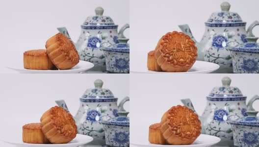 中秋节期间向朋友或家人聚会赠送月饼/月饼/月饼上的汉字在英语中代表“双白”高清在线视频素材下载