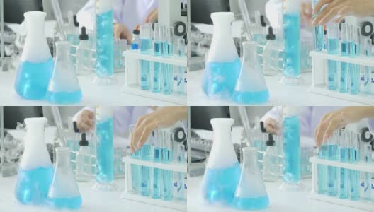 蓝色化学物质与烟雾在实验室沸腾，化学实验高清在线视频素材下载