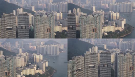 香港航拍v49飞越线铁湾，透过数码港及田湾一带的高层公寓景观。高清在线视频素材下载